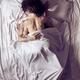 Couple kissing in bed in the morning... (thumbnail)