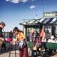 Woman tourist buying CD of street musician in Quebec city... (thumbnail)