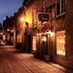 Jules Perrier and other shops lit with street light at night in Old Qu... (thumbnail)