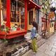 Young woman in front of the shop display on Rue du Petit Champlain his... (thumbnail)