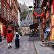 Two persons dressed in medieval costumes walking up the Rue Sous Le Fo... (thumbnail)
