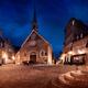 Nighttime view of Notre-Dame-des-Victoires Church and statue of Louis... (thumbnail)