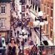 Young woman walking up the stairs of historic street Rue du Petit Cham... (thumbnail)