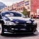 Black Tesla Model S luxury electric car parked on a city street... (thumbnail)