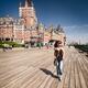 Woman walking on Dufferin terrace by the Fairmont Le Chateau Frontenac... (thumbnail)