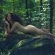 Sensual art nude portrart of a beautiful woman with long brown hair ly... (thumbnail)