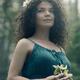 Portrait of a beautiful woman with a wreath on her head and a flower i... (thumbnail)