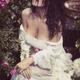 Sensual portrait of a beautiful woman in wet clothes sitting in rose g... (thumbnail)