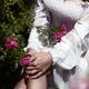 Sensual closeup photo of a sexy woman in a rose garden with rain drops... (thumbnail)
