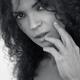 Black and white face portrait of a young brunette woman with a deep ex... (thumbnail)