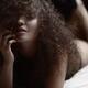 Sensual artistic portrait of a woman lying in bed with her hair coveri... (thumbnail)