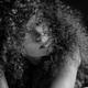 Sensual expressive black and white portrait of a woman lying on a bed... (thumbnail)