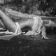 Beautiful sexy young woman in beach wear lying under pouring rain Blac... (thumbnail)