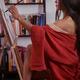 Portrait of asian woman sumi-e artist in red kimono with easel paintin... (thumbnail)