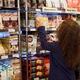Woman at a grocery store in organic products section... (thumbnail)