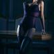 Sensual portrait of a woman in a corset and stockings leaning against... (thumbnail)
