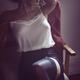 Sexy woman sitting in chair half dressed in night shirt and stockings... (thumbnail)