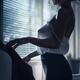 Sensual boudoir portrait of woman wearing a sexy see-through sheer blo... (thumbnail)