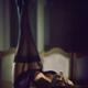 Sensual boudoir portrait of sexy woman lying on table in corset and st... (thumbnail)