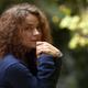 Candid natural portrait of young woman with tranquil thoughtul express... (thumbnail)