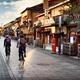 Cyclists on Hanamikoji Dori street in Gion district in the morning Kyo... (thumbnail)