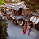 Two Maiko Geisha apprentices in colorful kimono on old street Yasaka d... (thumbnail)
