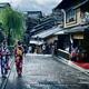 Two girls in bright Yukata kimonos with their obi tied in bow walking... (thumbnail)