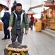 Man walking towards love stone at Jishu Jinja matchmaking shrine at Ki... (thumbnail)