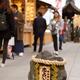 Young woman walking towards the love stone at Jishu Jinja shrine at Ki... (thumbnail)