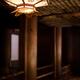 Lantern and wooden pillars interior architectural detail of temple in... (thumbnail)