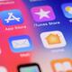 Closeup of iPhone screen with app icons on colorful display... (thumbnail)