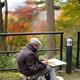 Japanese artist painting Kiyomizu-dera pagoda in autumn Kyoto... (thumbnail)