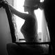 Sensual couple black and white portrait Man tying blindfold on a beaut... (thumbnail)