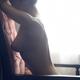 Artistic nude portrait of a beautiful woman sitting naked in an armcha... (thumbnail)