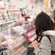 Women looking at the display of cosmetics in a Japanese makeup and bea... (thumbnail)
