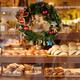 Bakery store window with breads and pastries on display during Christm... (thumbnail)