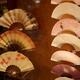 Traditional Japanese paper folding fans in store window display... (thumbnail)