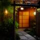 Illuminated with lanterns entrance door of Mizai traditional Japanese... (thumbnail)