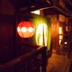 Traditional teahouse red lantern by the entrance door lit up at night... (thumbnail)