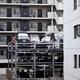 Multi-level vertical three-storey automated parking lot with a lift in... (thumbnail)