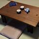 Japanese tea table Chabudai with tea on it in a traditional room of a... (thumbnail)