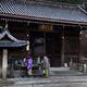Japanese couple washing hands at chozubachi cleansing basin at Todorok... (thumbnail)