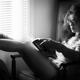Black and white portrait of a sexy woman in large reading glasses at h... (thumbnail)