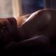 Sensual romatic portrait of a woman lying down naked closeup of her ch... (thumbnail)