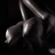Black and white art nude portrait of a sexy woman with her body lit by... (thumbnail)