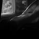 Art nude black and white photo of a sexy beautiful woman body in a dar... (thumbnail)