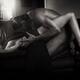 Sexy couple making love on a sofa Woman in a long dress and a naked ma... (thumbnail)