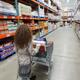 Woman with a shopping cart at Costco Wholesale warehouse store... (thumbnail)