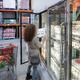 Woman picking a crate of eggs at Costco Wholesale warehouse store food... (thumbnail)
