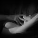 Romantic couple black and white closeup of man's hand touching wo... (thumbnail)